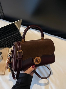 Retro patchwork handbag in dark reddish-brown patent leather and suede with metal clasp