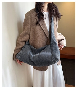 Retro denim hobo shoulder bag shown on model for size and slouchy aesthetic look