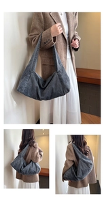 Detail of the oversized grey washed denim hobo bag with wide shoulder strap and soft pleats