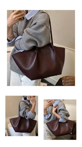 Detailed view of burgundy wing-shaped tote bag in high-gloss leather for daily use