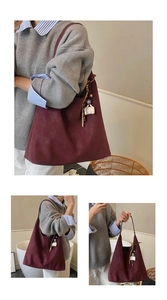 Macro detail of wine red suede tote bag with coffee cup charm and beaded tassel