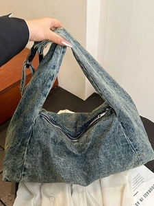 Retro washed denim tote bag with adjustable strap and casual slouchy hobo style design