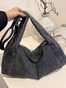 Retro grey washed denim hobo shoulder bag with adjustable strap and buckle closure