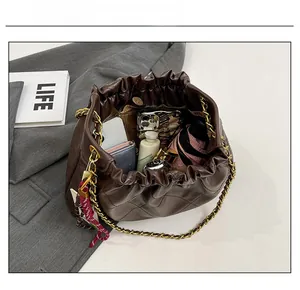 Top view of spacious brown quilted tote bag showing large interior capacity for daily items