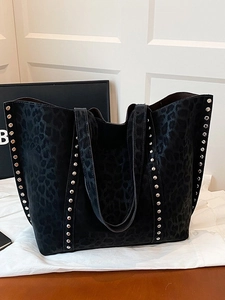 Large black leopard print tote bag with silver metal rivets and stylish shoulder straps