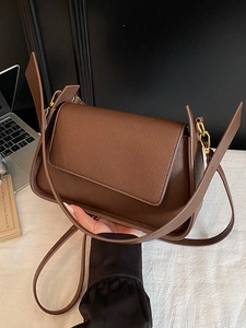 Brown litchi grain leather shoulder bag with gold clasp and flip-top closure design