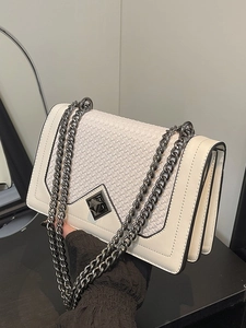 Chic white underarm bag with woven flap detail, metal chain strap and accordion fold structure