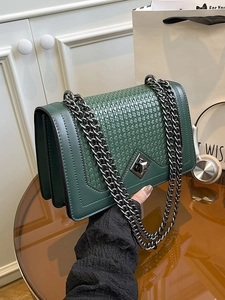 Deep green faux leather shoulder bag with woven texture and metallic chain strap