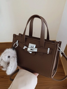 Dark brown lychee pattern leather handbag with silver lock and fluffy rabbit charm