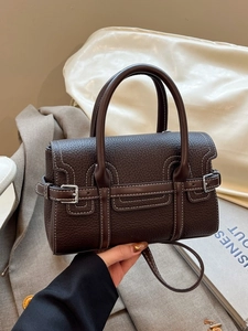 Deep brown litchi pattern leather tote bag with white contrast stitching and dual handles