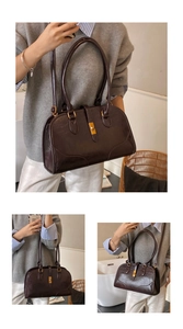Detailansicht der braunen Boston Bag mit edler goldener Schnalle und Wildleder-Struktur