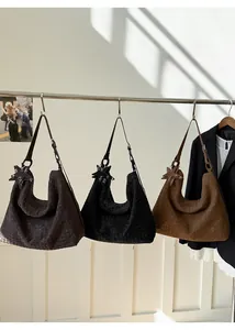 Detail view of woven leather texture on a spacious hobo bag with star pendant
