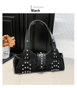 Detail of black leopard print shoulder bag with silver studs and polished leather texture
