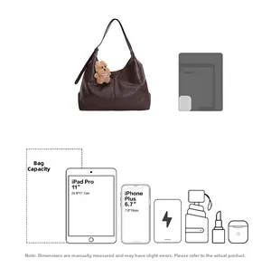 Detail view of large brown vintage tote bag capacity fitting iPad Pro and daily essentials
