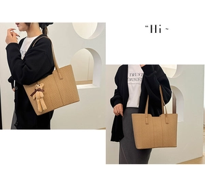 Detail of khaki chevron tote bag with shoulder strap and a cute teddy bear charm
