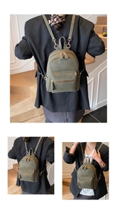 Detail view of mini olive green faux suede backpack with premium gold metal zippers