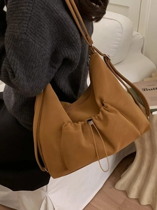 Vintage caramel faux suede tote bag with drawstring detail and adjustable shoulder strap