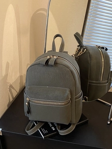 Retro dark green faux suede mini backpack for women with white contrast stitching