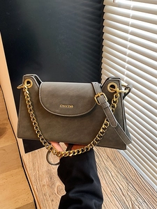 Vintage dark gray crossbody bag with gold chain strap and matte leather texture