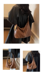 Detail of a large brown leather Hobo tote bag featuring a colorful beaded tassel charm