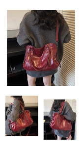 Detail view of burgundy tote bag showing glossy leather texture and silver zipper accents