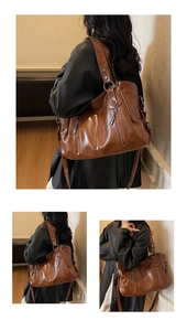 Detailed views of the vintage brown faux leather tote bag with wide shoulder straps
