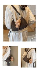 Deep brown crescent hobo bag with plush bear charm and elegant pearl necklace detail