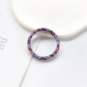 Detail shot of the floral fabric texture on a high-elastic seamless hair tie
