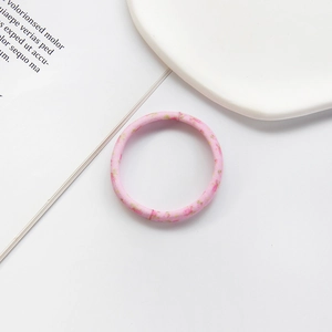 Close-up of pink floral seamless high-elastic hair tie with delicate petal patterns