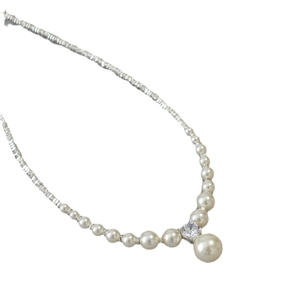 Minimalist pearl necklace with silver beads and a central round sparkling crystal pendant