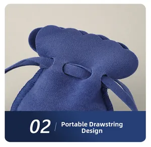 Detail of blue suede jewelry pouch with portable drawstring and wavy edge design