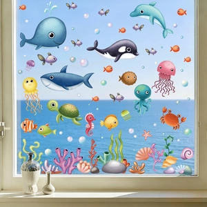 Detailed view of colorful ocean cartoon window stickers featuring whales and sea animals