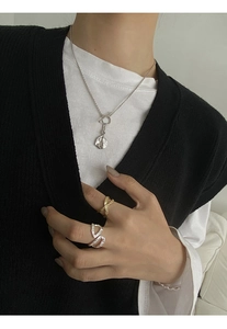 Detailed close-up of S925 sterling silver OT toggle necklace with hammered medal pendant