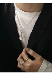 S925 silver irregular toggle clasp necklace and textured rings on a model