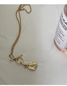 Detail of S925 silver golden OT buckle necklace with irregular hammered texture pendant