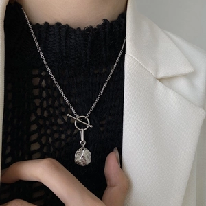 S925 sterling silver OT clasp necklace with irregular textured coin pendant on model