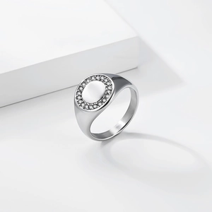 Close-up of a silver titanium steel signet ring with a circle of sparkling cubic zirconia
