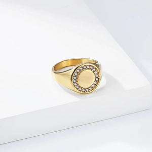 Close-up of gold-plated titanium steel signet ring with micro-paved sparkling zircon stones