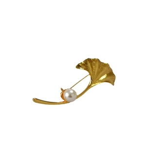 Elegant gold ginkgo leaf brooch with a white pearl accent for sweaters and coats