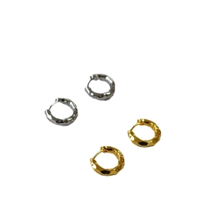 Textured hammered hoop earrings in gold and silver finish with minimalist design