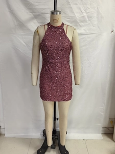Close-up of sparkling magenta sequins and halter neckline on a bodycon party dress