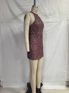 Detail of sequined purple halter neck dress featuring shimmering crystal fringe texture