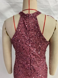 Detail of sequin halter dress featuring an open back with a seamless invisible zipper