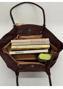 Deep brown suede tote bag interior showing large capacity for books and umbrella
