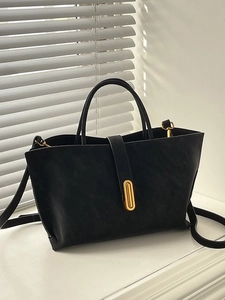 Matte black large capacity tote bag with gold metal buckle and adjustable shoulder strap