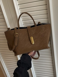 Retro dark brown frosted leather handbag with oval gold buckle and reinforced handles