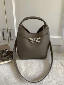 Retro brown bucket bag in litchi grain leather with unique X-shaped silver metal buckle