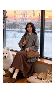 Brown suede tote bag styled with a long wool coat and skirt in a cozy urban setting