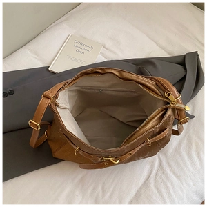 Top view showing the large interior capacity and zipper pocket of the bronze tote bag