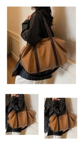 Détail d'un grand sac fourre-tout marron en simili cuir avec coutures blanches et anses